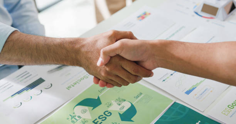 Business handshake representing team coordination and collaboration
