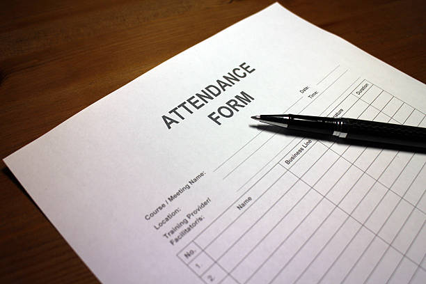 Pen resting on an Attendance Form