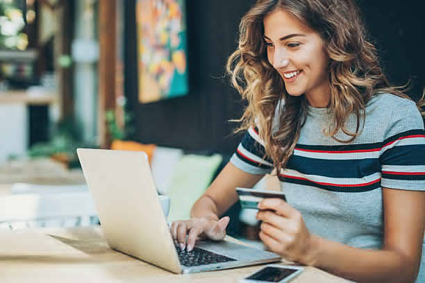 Woman reviewing attendance records on a laptop