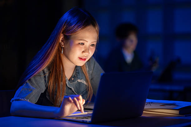 Woman securely accessing attendance data on laptop