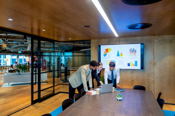 People in a meeting room looking at a presentation
