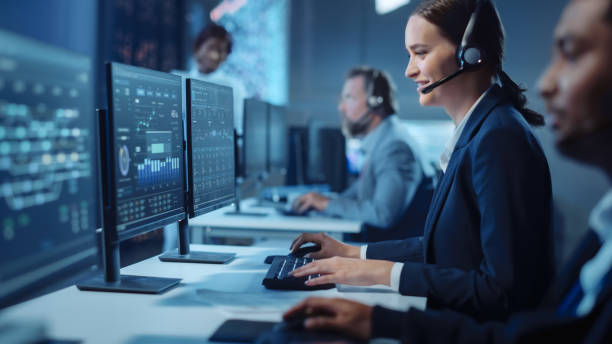 Call center agents working at computers