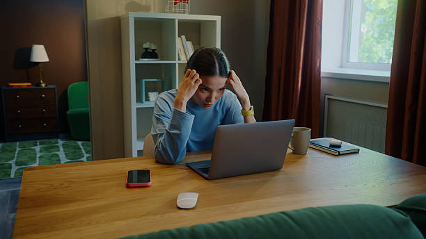 Woman looking at a laptop