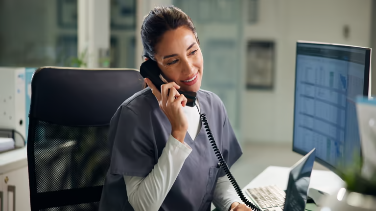 Employee on the phone checking records