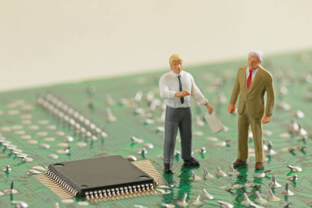 Miniature figures on a circuit board representing automated alerts