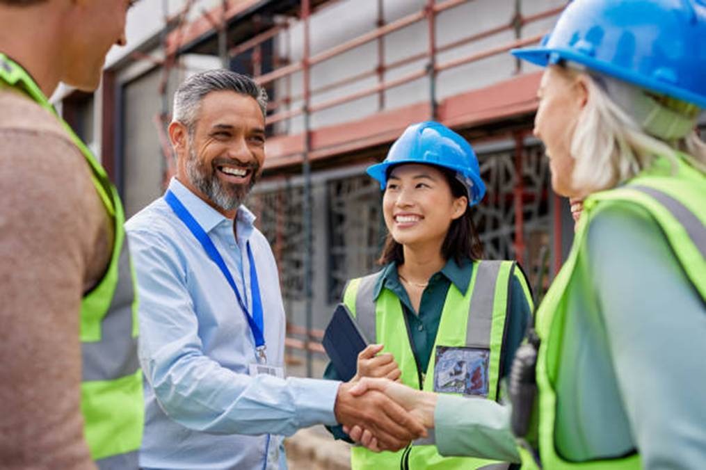 Construction company employees and managers at a job site