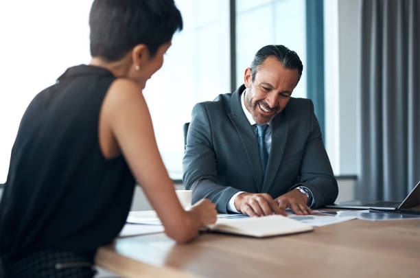 Two professionals reviewing client billing reports