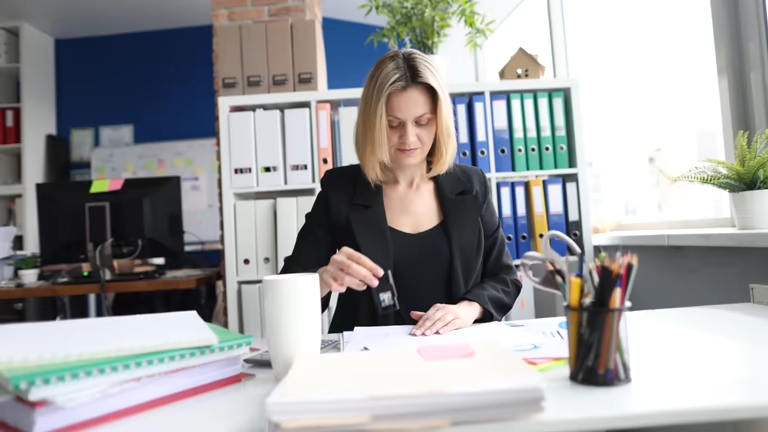 HR professional reviewing compliance documents