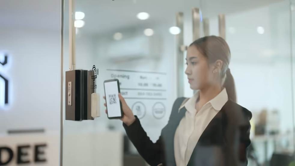 Employee using contactless attendance tracking system