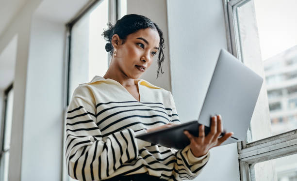 Woman analyzing data on a tablet device