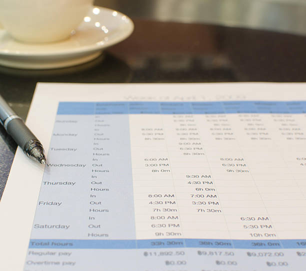 Pen on a printed schedule timesheet