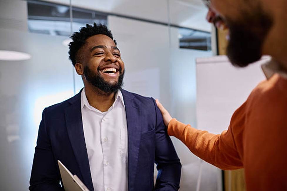 Happy employee showing engagement and motivation at work