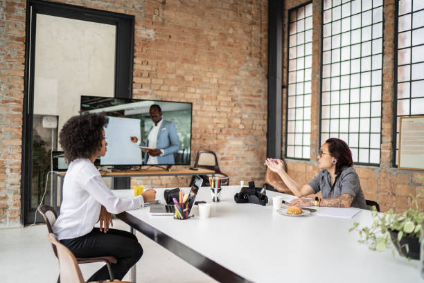 Two employees having a meeting in a conference room