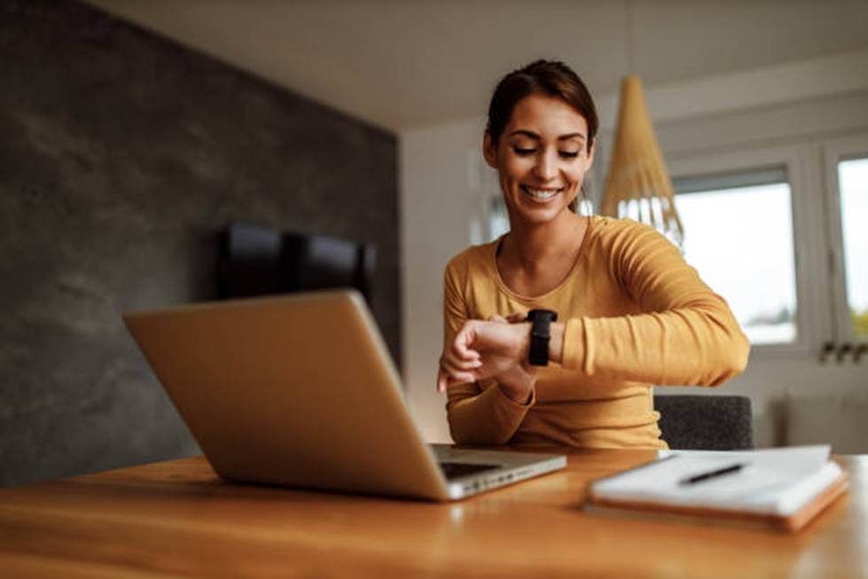 Employee checking time tracking software for customization and scalability