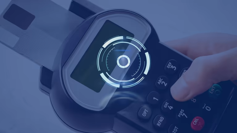 Close-up of a hand pressing a button on a biometric device