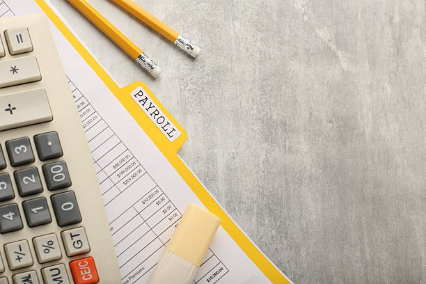 Payroll document and calculator showing duplicate hours challenge