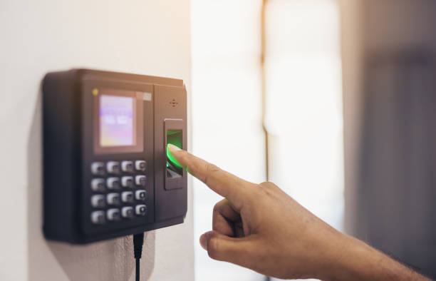 Employee using a fingerprint biometric scanner