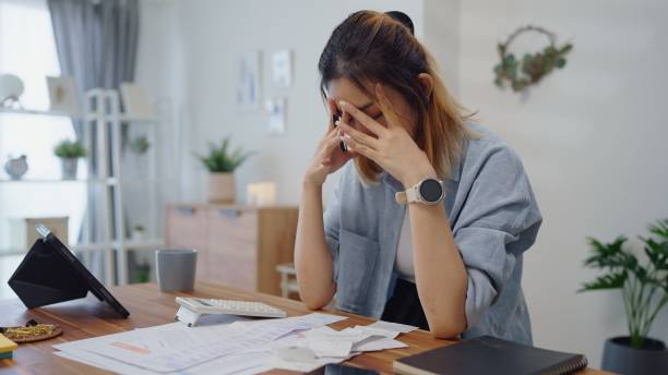 Stressed woman at a desk
