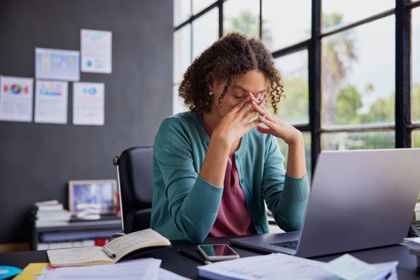 Frustrated employee looking at laptop