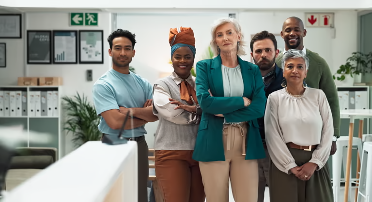 Group of diverse professionals standing together confidently