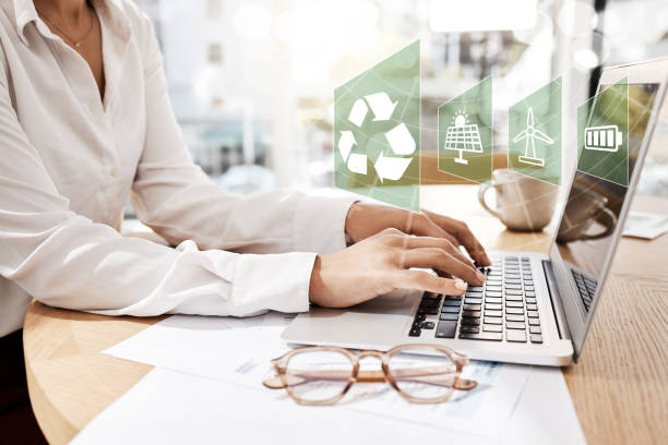 Employee typing on laptop with eco icons