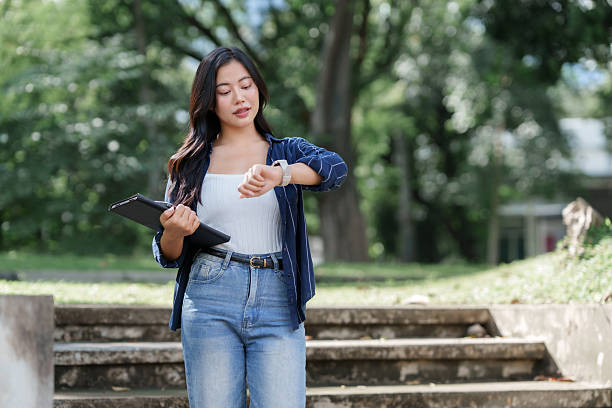 Woman checking her smartwatch outdoors