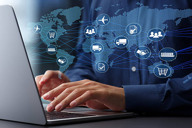 Global network and laptop representing multi-location business management