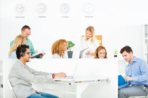 Office team with time zone clocks