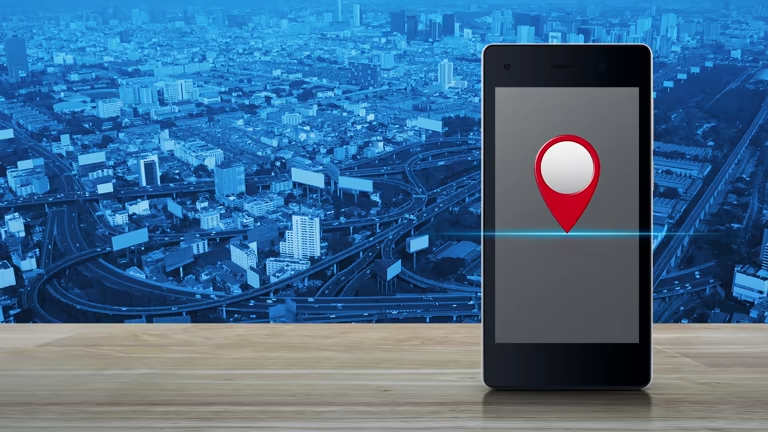 Smartphone with GPS pin on a desk
