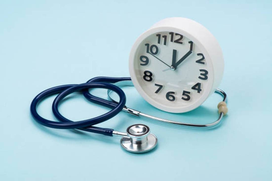 Clock and stethoscope representing OpenTimeClock versus TimeDoctor cost comparison