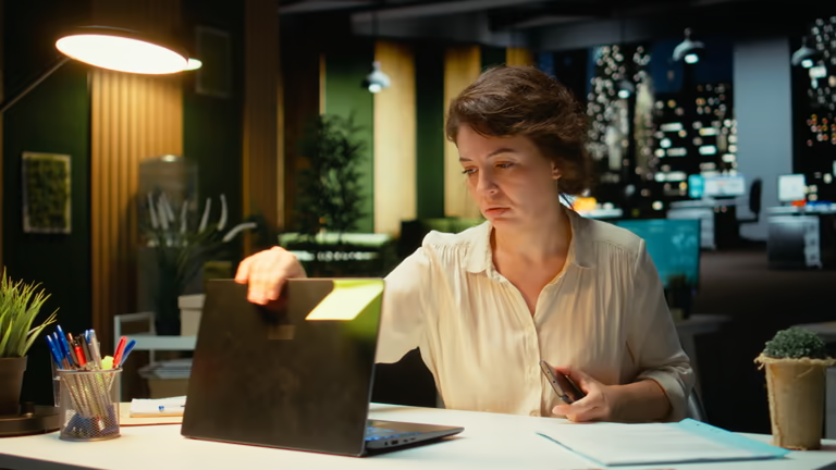 Employee working late and managing secure access levels
