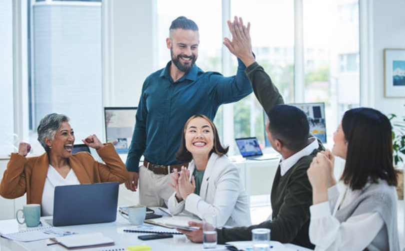 Employees celebrating success and engagement in the workplace