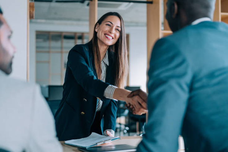 Business handshake representing workplace transparency and trust