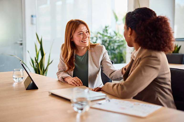 Manager encouraging employee to boost workplace motivation