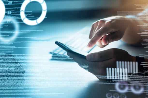 Person using a tablet with digital data overlay