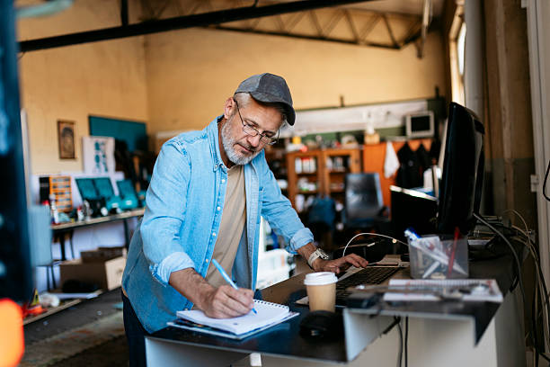 Small business owner keeping records in a workshop