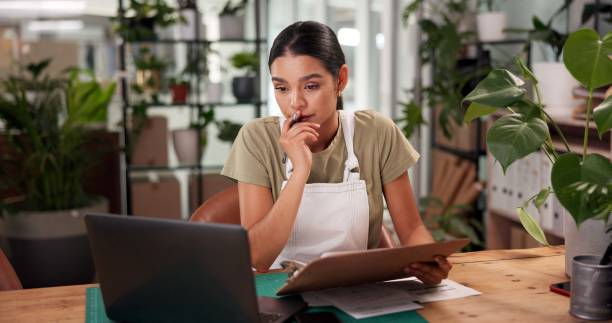 Woman working on a laptop managing data