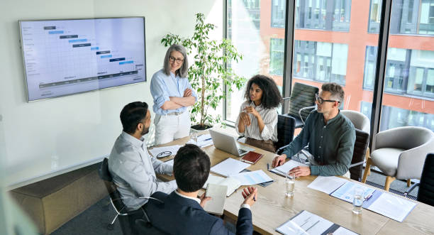 Team meeting discussing time tracking rules
