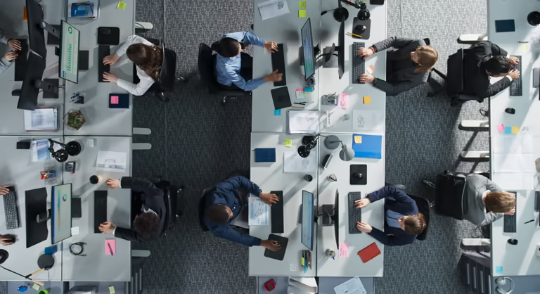 Overhead view of employees working securely in a modern office
