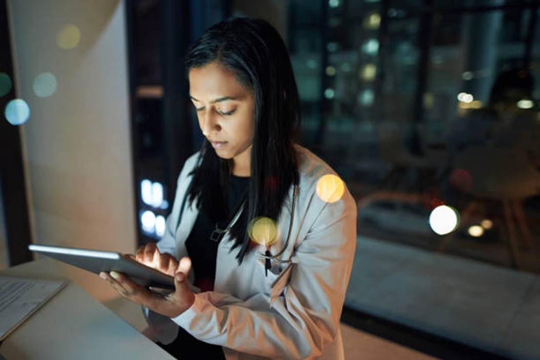 Employee using tablet representing security and data protection