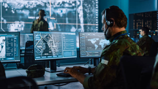 Security personnel looking at screens