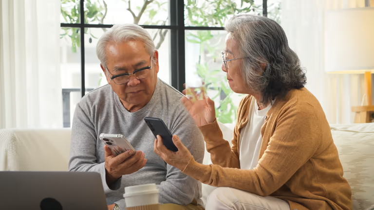 People reviewing security protocols on mobile devices