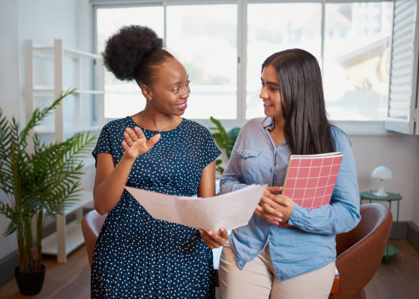 Two women standing and talking