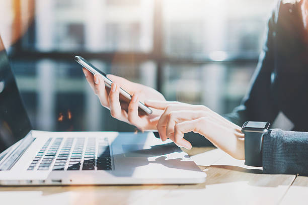 Employees clocking in at a shared work zone using mobile devices