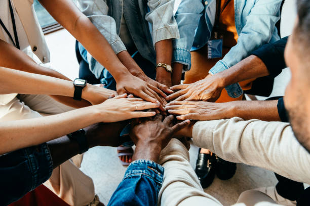 Team putting hands together