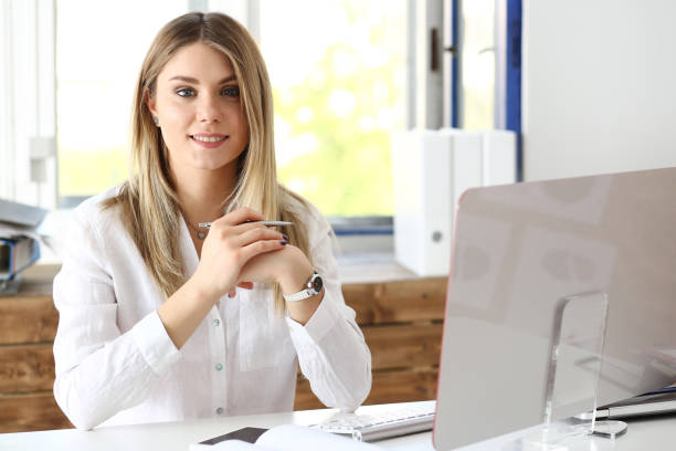 Smiling woman at office desk