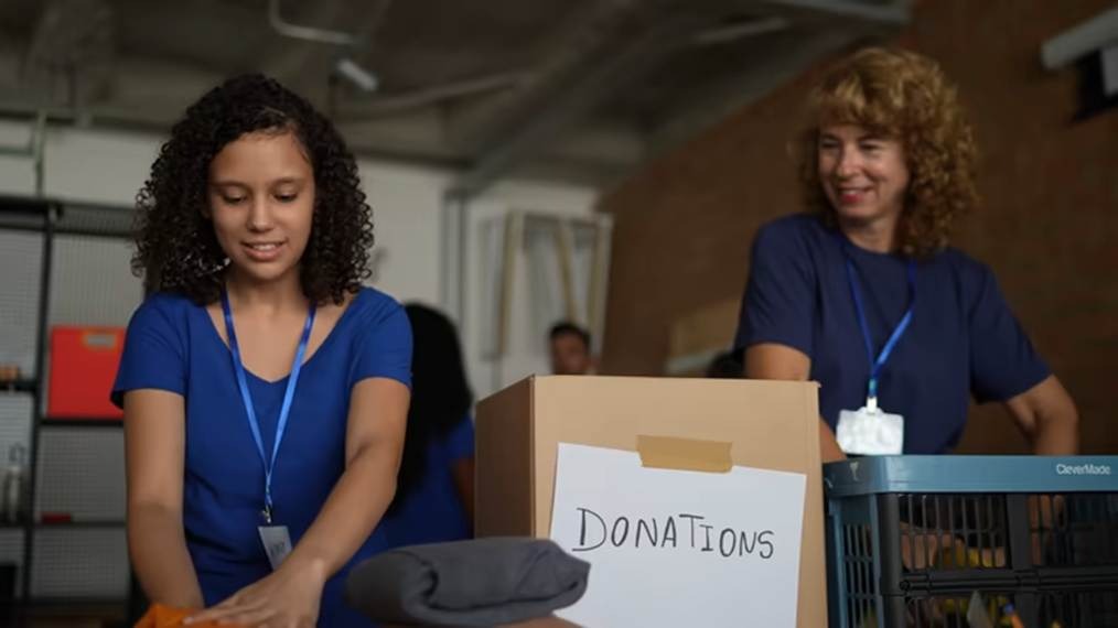 Nonprofit volunteers organizing donations with OpenTimeClock time tracking