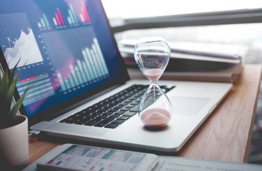 Time tracking reporting and analytics dashboard on laptop
