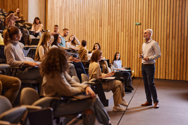 Teacher presenting in a classroom for cloud-based attendance tracking
