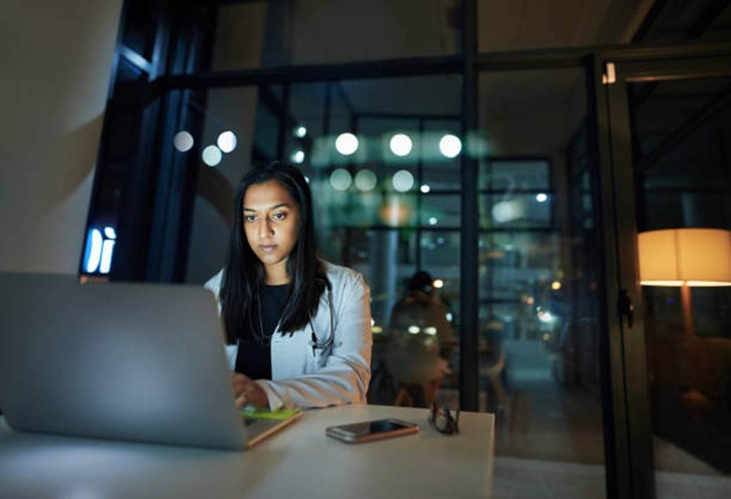 Employee using laptop representing user interface and user-friendliness